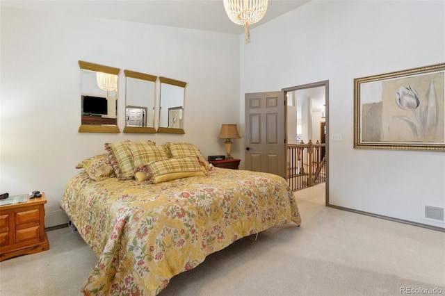 bedroom with light colored carpet