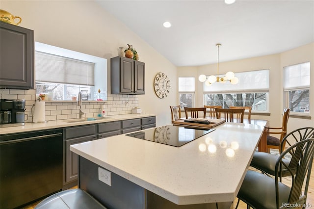 6545 Bonifas Ct, Colorado Springs, CO 80919 - kitchen with a sink, black electric cooktop, dishwasher, and a healthy amount of sunlight