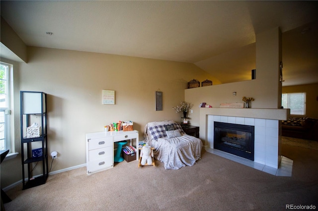 9950 Sydney Ln, Highlands Ranch, CO 80130 - bedroom featuring carpet floors, a fireplace, vaulted ceiling, and baseboards