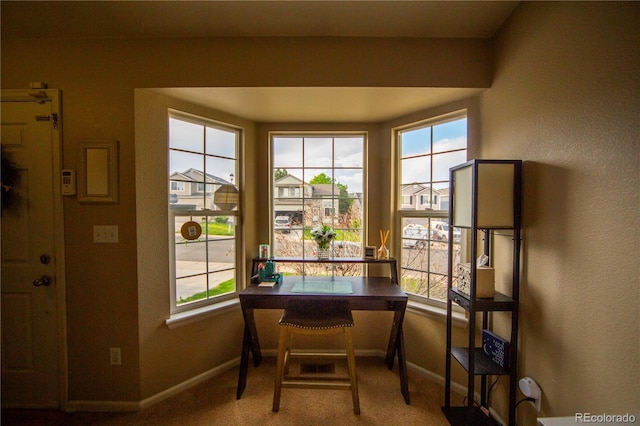 9950 Sydney Ln, Highlands Ranch, CO 80130 - carpeted dining area with healthy amount of natural light, baseboards, and a textured wall