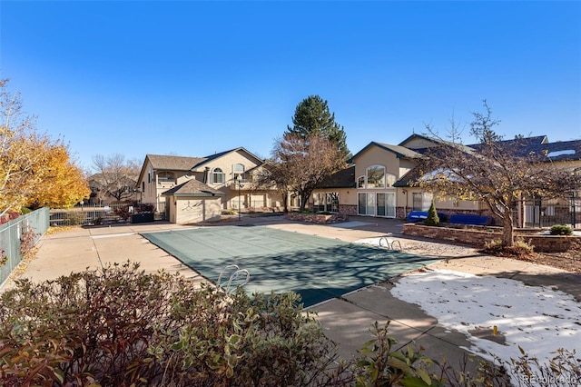 exterior space featuring fence and a fenced in pool