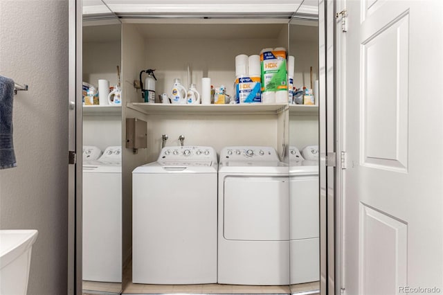 clothes washing area featuring washing machine and dryer