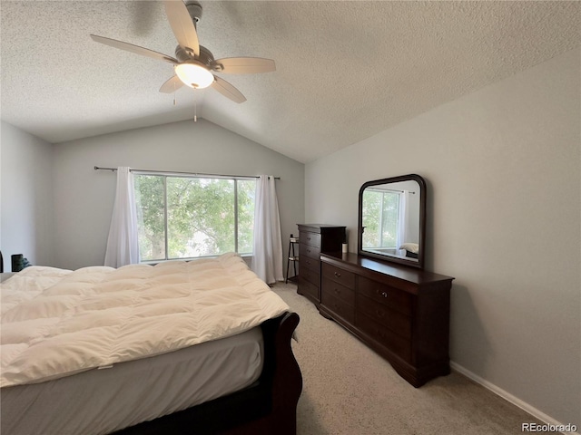 bedroom with lofted ceiling, light colored carpet, a ceiling fan, a textured ceiling, and baseboards