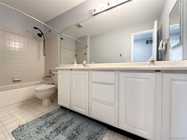 full bathroom with  shower combination, double vanity, toilet, and tile patterned floors