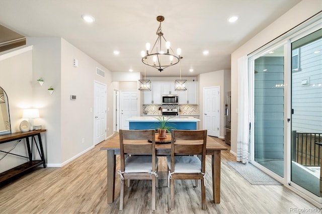 8586 Holman Ct Unit A, Arvada, CO 80005 - dining area featuring a chandelier, light wood-type flooring, baseboards, and recessed lighting
