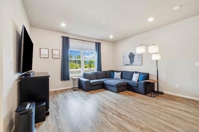 8586 Holman Ct Unit A, Arvada, CO 80005 - living room featuring light wood-style flooring, baseboards, and recessed lighting