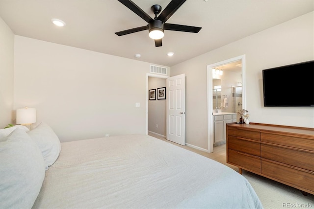 8586 Holman Ct Unit A, Arvada, CO 80005 - bedroom with recessed lighting, ensuite bathroom, ceiling fan, baseboards, and light colored carpet