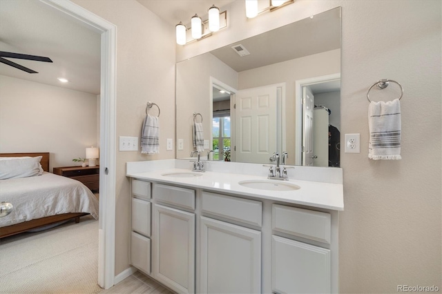 8586 Holman Ct Unit A, Arvada, CO 80005 - full bathroom with connected bathroom, double vanity, and ceiling fan