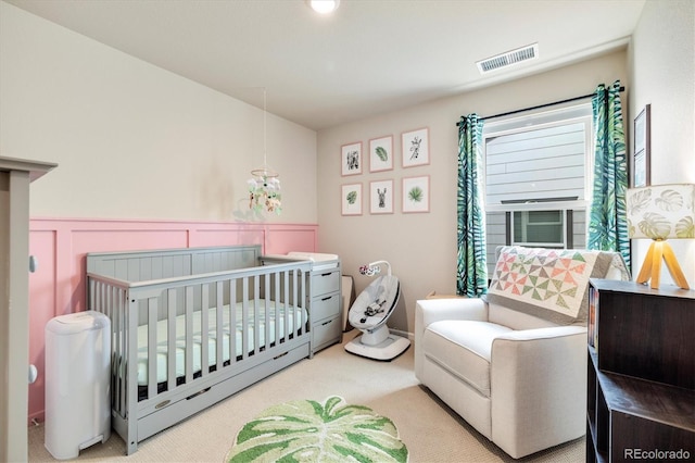 8586 Holman Ct Unit A, Arvada, CO 80005 - bedroom with carpet flooring, wainscoting, and a crib