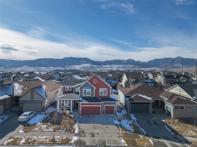 birds eye view of property featuring a mountain view