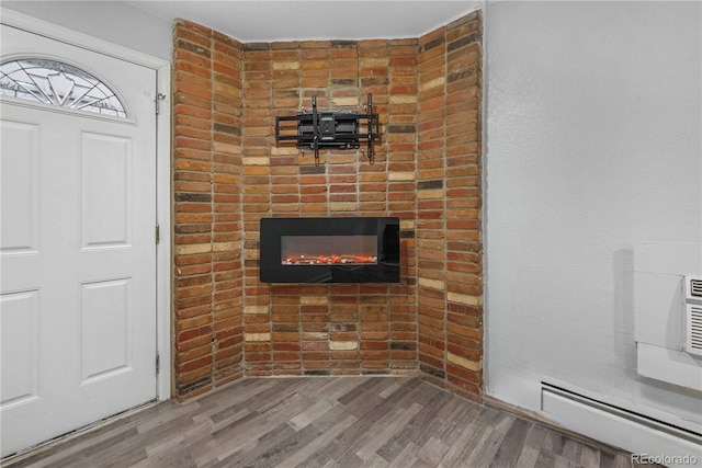 interior details with a fireplace and hardwood / wood-style floors