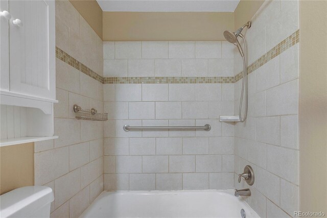 2190 S Holly St Unit 207, Denver, CO 80222 - bathroom with toilet and tiled shower / bath