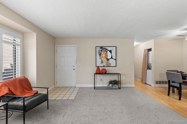 10212 W 80th Dr Unit C, Arvada, CO 80005 - sitting room featuring carpet flooring, a textured ceiling, and ceiling fan