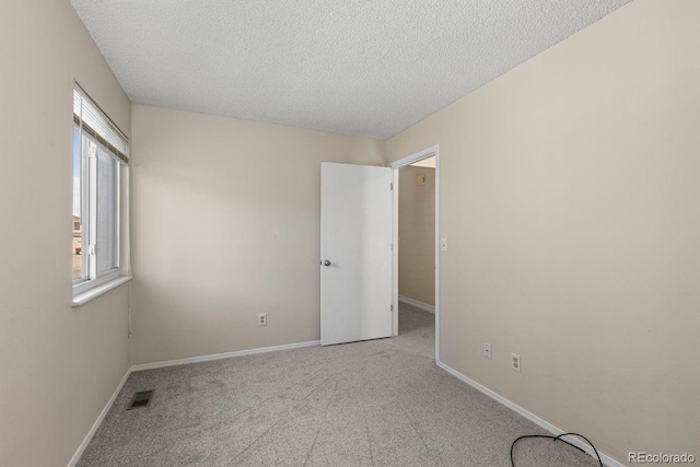 10212 W 80th Dr Unit C, Arvada, CO 80005 - carpeted empty room featuring plenty of natural light and a textured ceiling