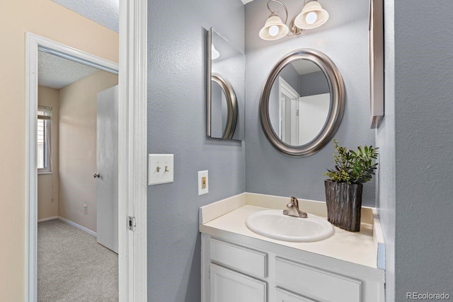 10212 W 80th Dr Unit C, Arvada, CO 80005 - bathroom featuring vanity and a textured ceiling
