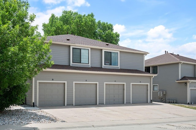 10212 W 80th Dr Unit C, Arvada, CO 80005 - multi unit property featuring a garage and driveway