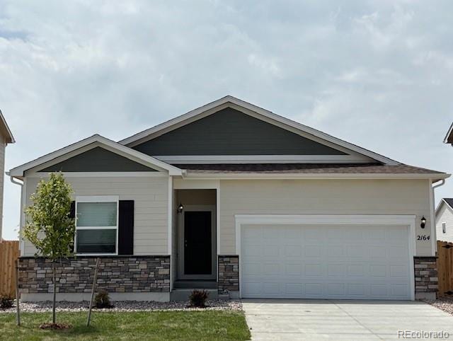 2164 Alyssa St, Fort Lupton, CO 80621 - craftsman-style home featuring stone siding, concrete driveway, and a garage