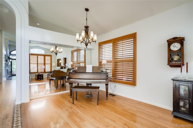 9451 Desert Willow Trl, Highlands Ranch, CO 80129 - dining area with a chandelier, wood finished floors, and baseboards