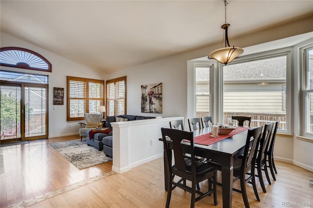 9451 Desert Willow Trl, Highlands Ranch, CO 80129 - dining space with vaulted ceiling, light wood-style flooring, and baseboards