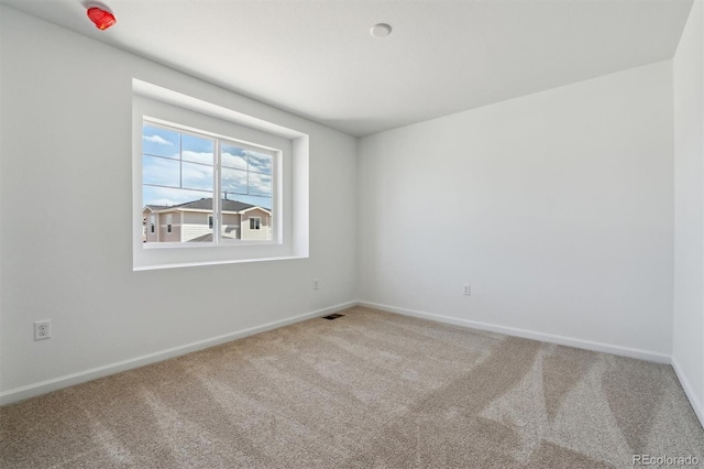 9672 Cathay St, Commerce City, CO 80022 - carpeted spare room with visible vents and baseboards