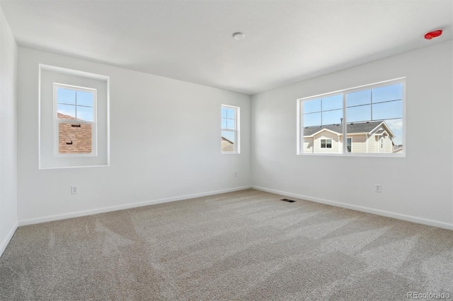 9672 Cathay St, Commerce City, CO 80022 - carpeted empty room with a wealth of natural light, visible vents, and baseboards