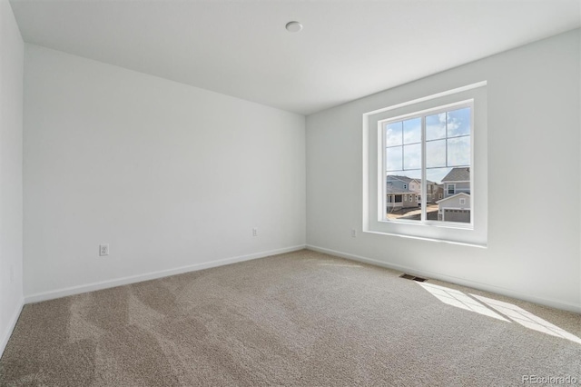9672 Cathay St, Commerce City, CO 80022 - spare room featuring visible vents, carpet flooring, and baseboards