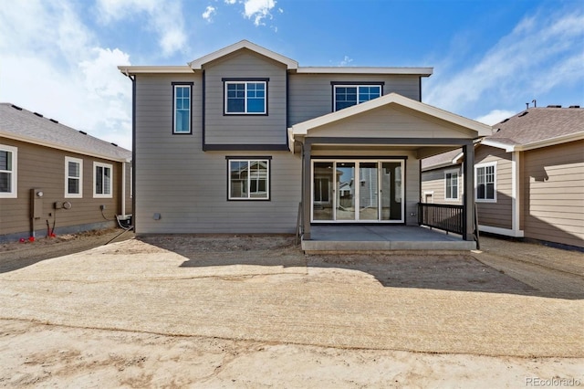9672 Cathay St, Commerce City, CO 80022 - rear view of house with a patio