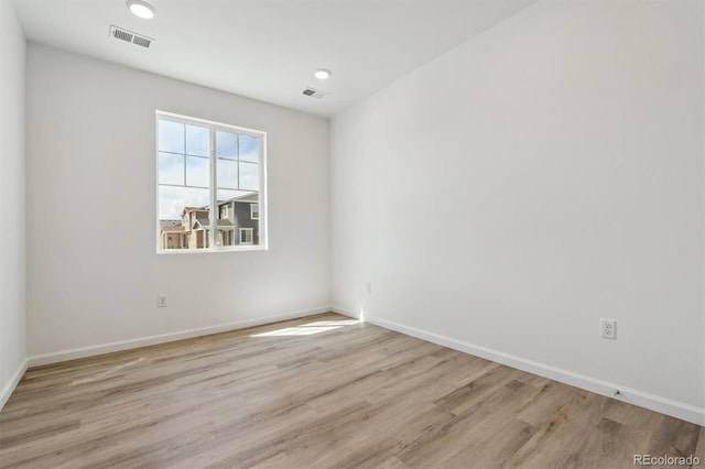 9672 Cathay St, Commerce City, CO 80022 - empty room with baseboards, light wood-style floors, and visible vents