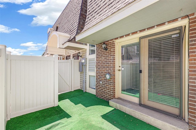 view of patio / terrace featuring fence