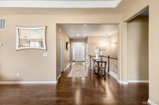 hall with dark hardwood / wood-style flooring