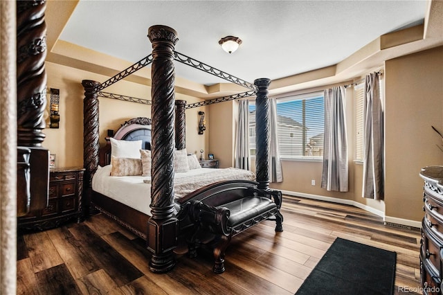 bedroom with hardwood / wood-style flooring