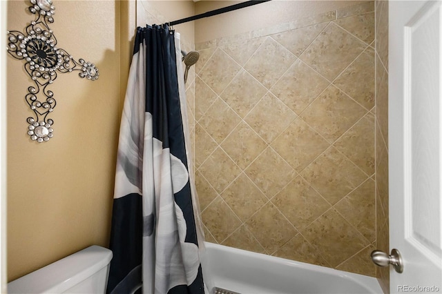 bathroom with shower / bathtub combination with curtain and toilet