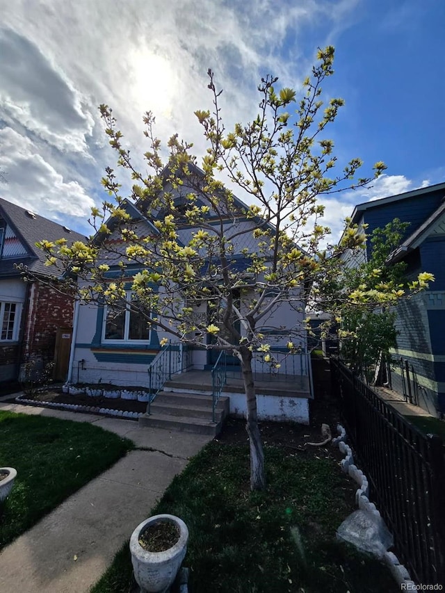 view of front of home with fence