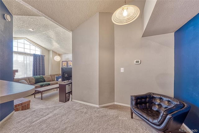 4760 S Wadsworth Blvd Unit 302, Littleton, CO 80123 - carpeted living area featuring a textured ceiling, vaulted ceiling, and baseboards