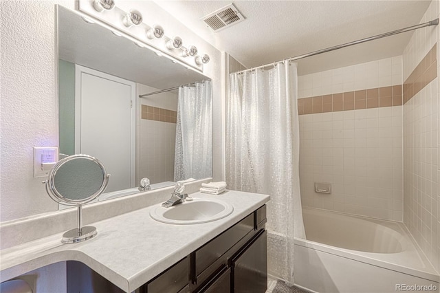 4760 S Wadsworth Blvd Unit 302, Littleton, CO 80123 - bathroom with shower / tub combo, vanity, and a textured wall