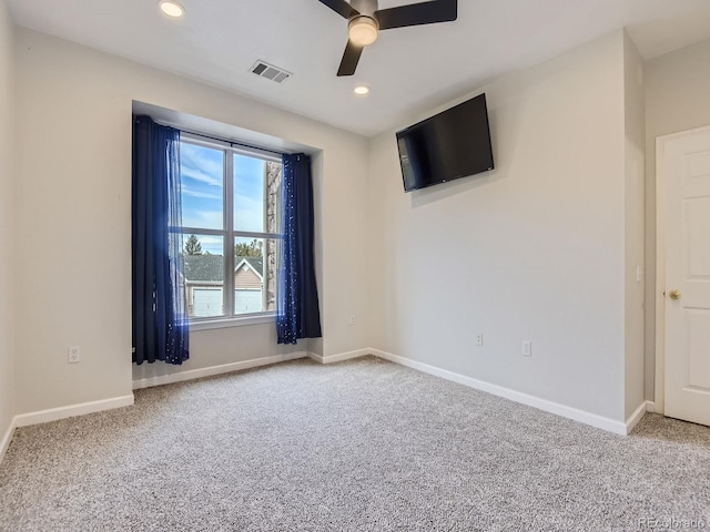 carpeted empty room with ceiling fan