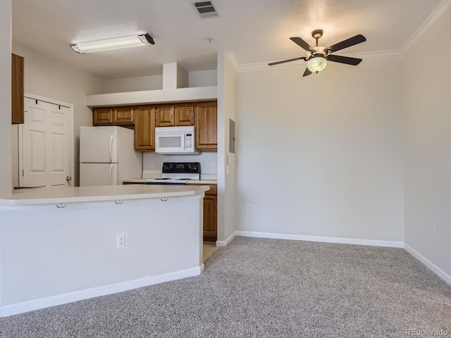 kitchen with kitchen peninsula, light carpet, white appliances, and ornamental molding