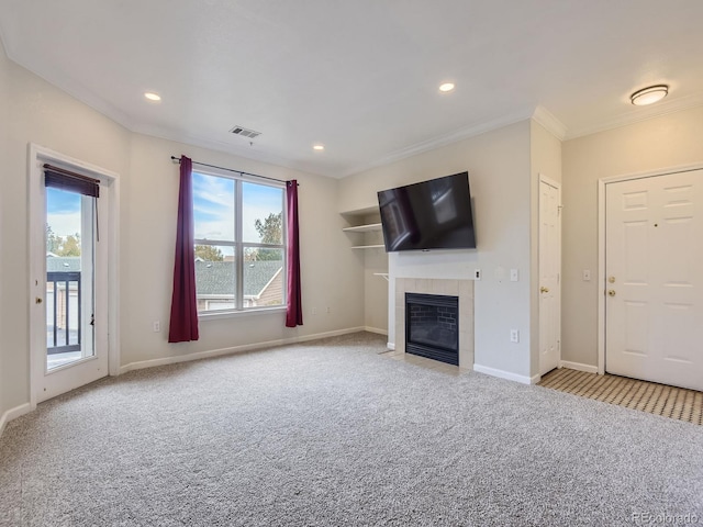 unfurnished living room with light carpet, crown molding, a fireplace, and a healthy amount of sunlight