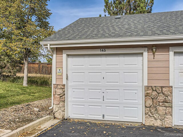 garage with fence