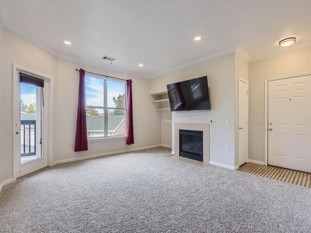 unfurnished living room featuring baseboards, a tiled fireplace, visible vents, and light colored carpet