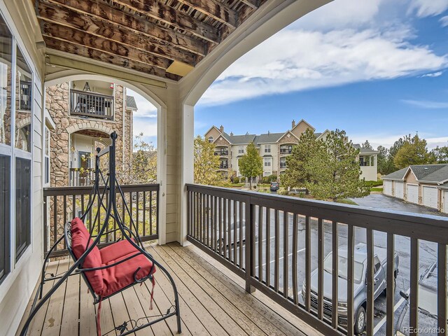 wooden deck with a residential view