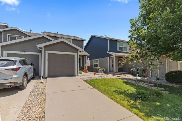 11062 Gaylord St, Northglenn, CO 80233 - view of front of property with driveway, a garage, and a front lawn