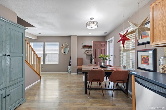 11062 Gaylord St, Northglenn, CO 80233 - dining area featuring stairs and light wood-style flooring