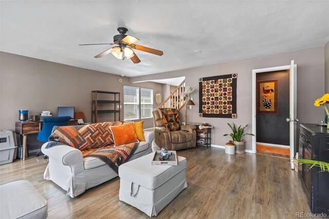 11062 Gaylord St, Northglenn, CO 80233 - living room with a ceiling fan, wood finished floors, and stairs