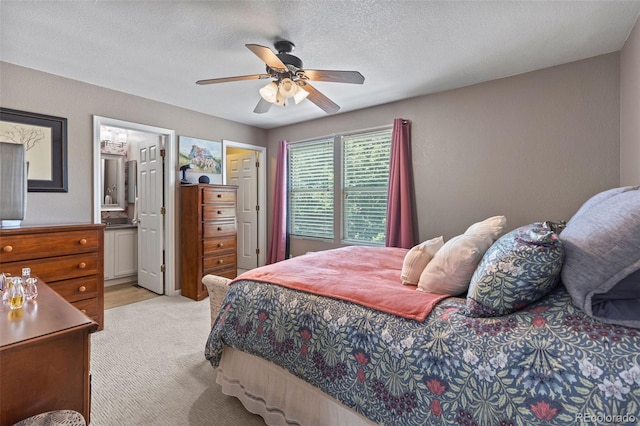 11062 Gaylord St, Northglenn, CO 80233 - bedroom with light colored carpet, ceiling fan, a textured ceiling, and ensuite bath