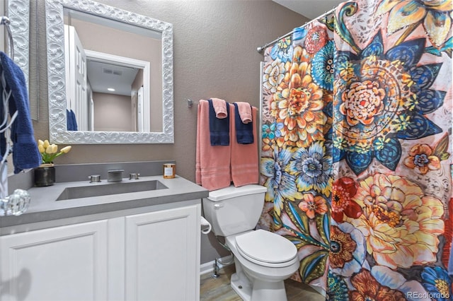 11062 Gaylord St, Northglenn, CO 80233 - full bathroom featuring vanity, a textured wall, and curtained shower