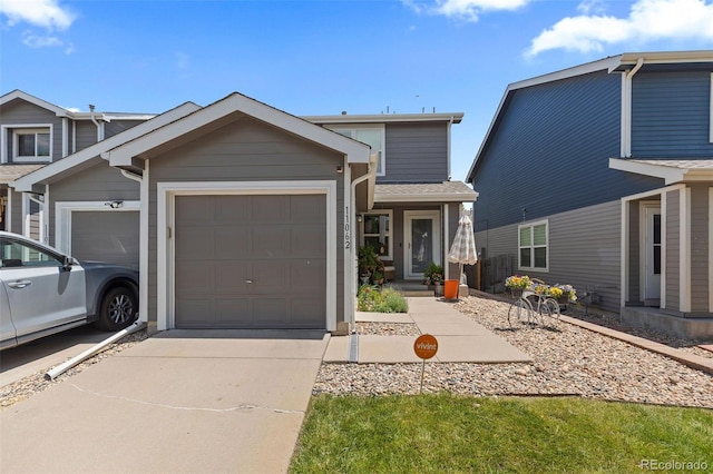 11062 Gaylord St, Northglenn, CO 80233 - view of front of home featuring driveway and a garage
