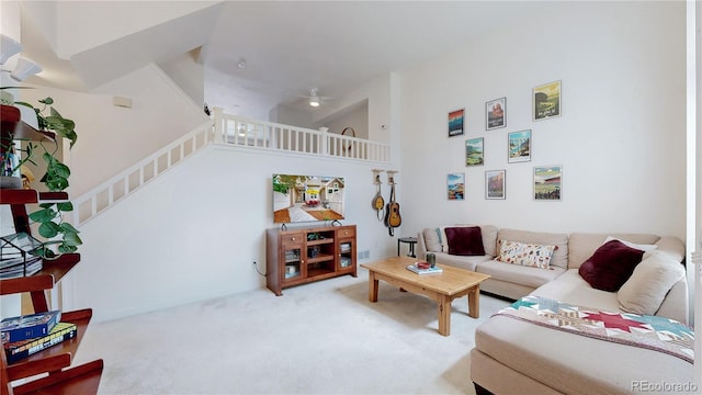 2560 Concord Cir, Lafayette, CO 80026 - living room with a high ceiling, stairs, ceiling fan, and carpet