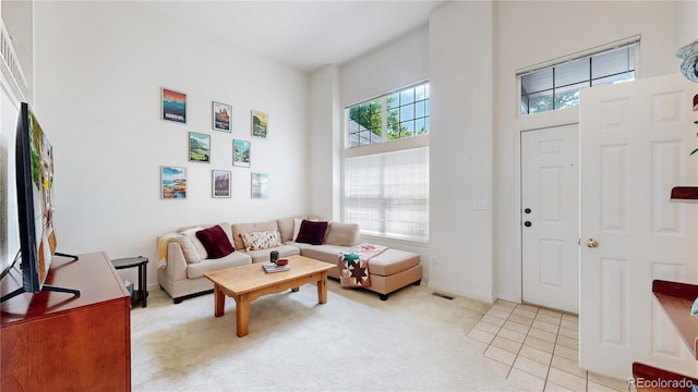 2560 Concord Cir, Lafayette, CO 80026 - living area featuring light colored carpet and a high ceiling