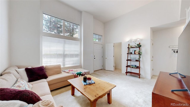 2560 Concord Cir, Lafayette, CO 80026 - living room featuring a towering ceiling and light colored carpet
